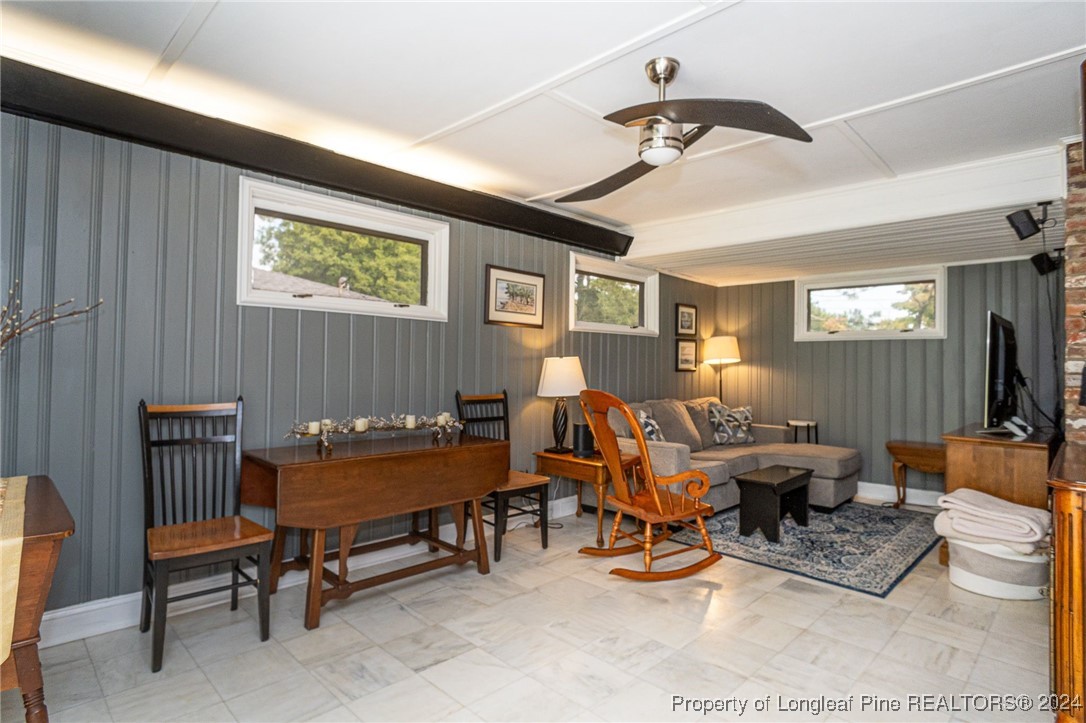 2539 Huntington Road Fayetteville, NC 28303 - Photo 12 of 39 a living room with furniture and a chandelier