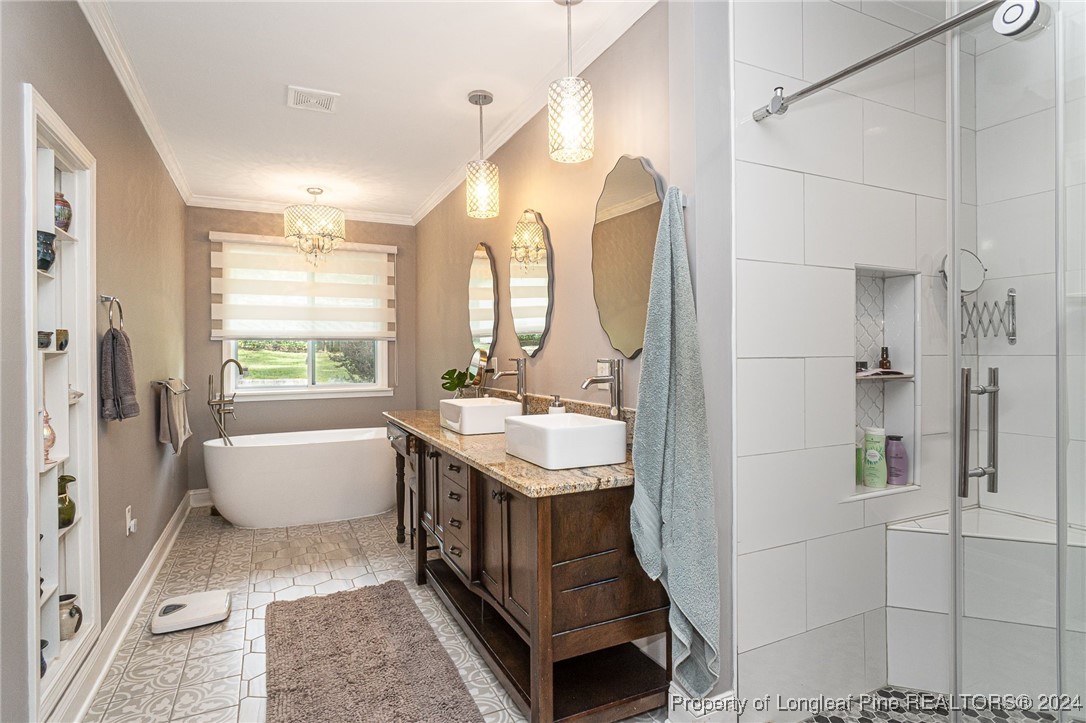 2539 Huntington Road Fayetteville, NC 28303 - Photo 21 of 39 a bathroom with a tub sink and mirror