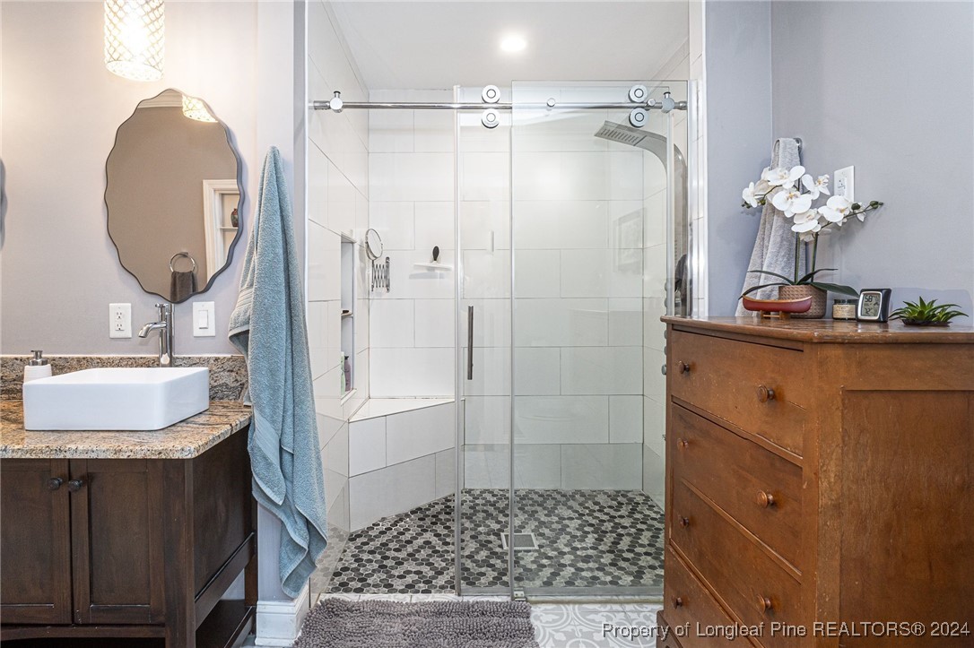 2539 Huntington Road Fayetteville, NC 28303 - Photo 22 of 39 a bathroom with a sink a toilet and shower