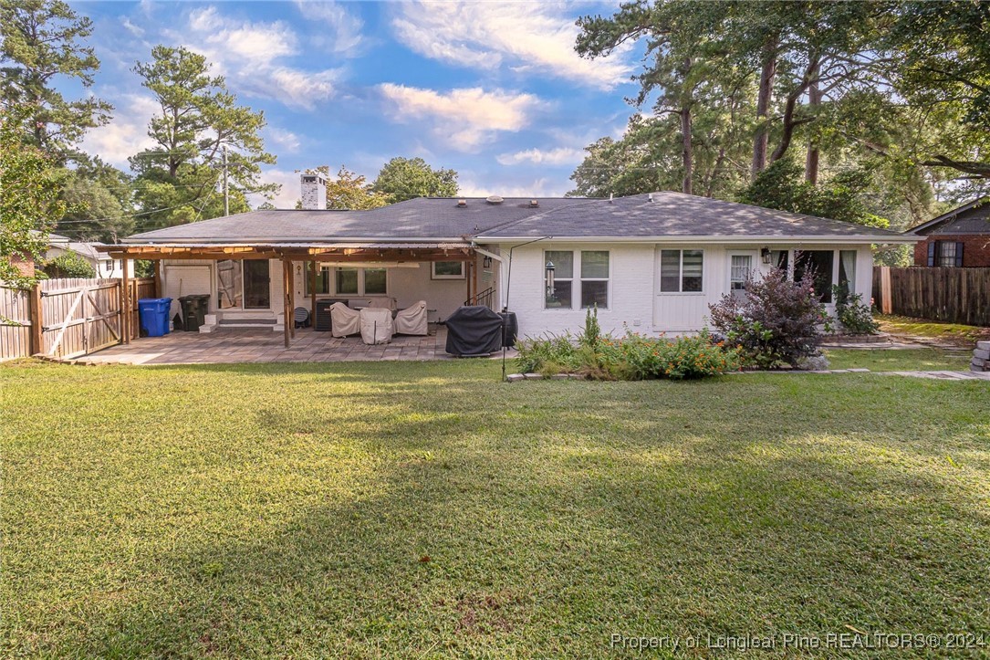 2539 Huntington Road Fayetteville, NC 28303 - Photo 32 of 39 a front view of a house with garden