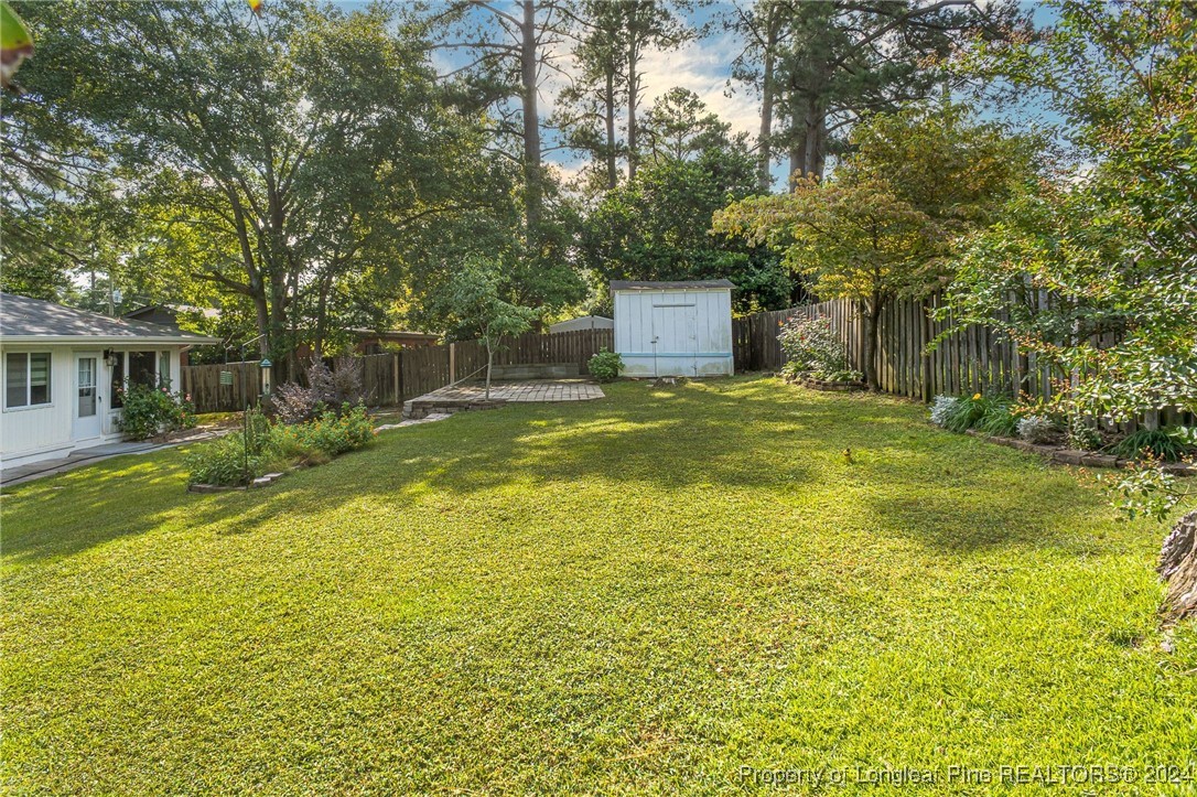 2539 Huntington Road Fayetteville, NC 28303 - Photo 38 of 39 a swimming pool with trees in the background