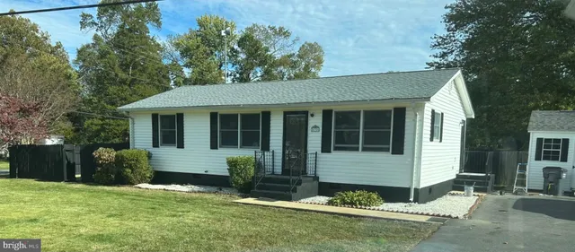 front view of a house with a yard