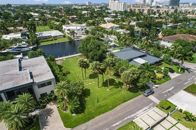 an aerial view of multiple houses with yard