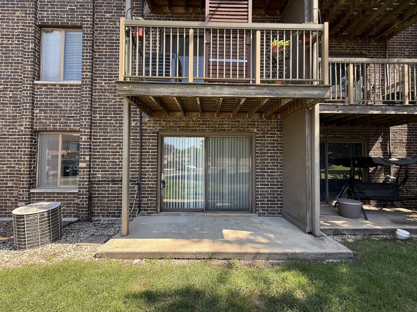 830 Elder Road, Unit 111 Homewood, IL 60430 - Photo 14 of 15 a view of house with backyard porch and sitting area