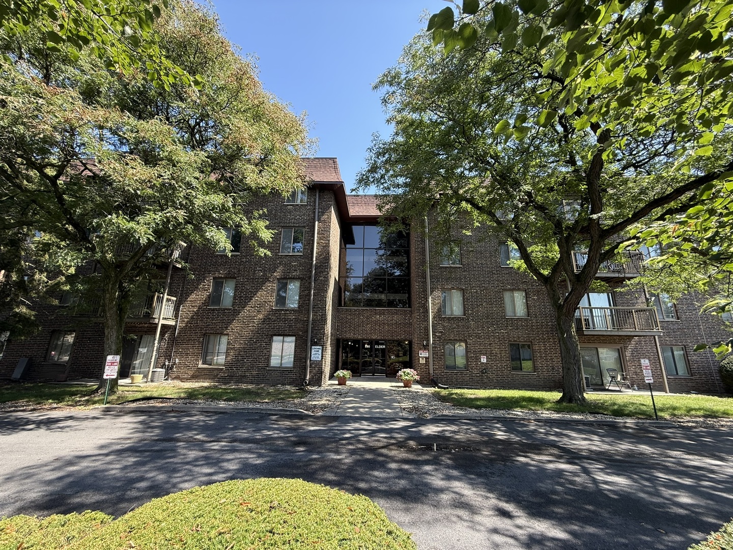 830 Elder Road, Unit 111 Homewood, IL 60430 - Photo 2 of 15 a view of a house with a tree