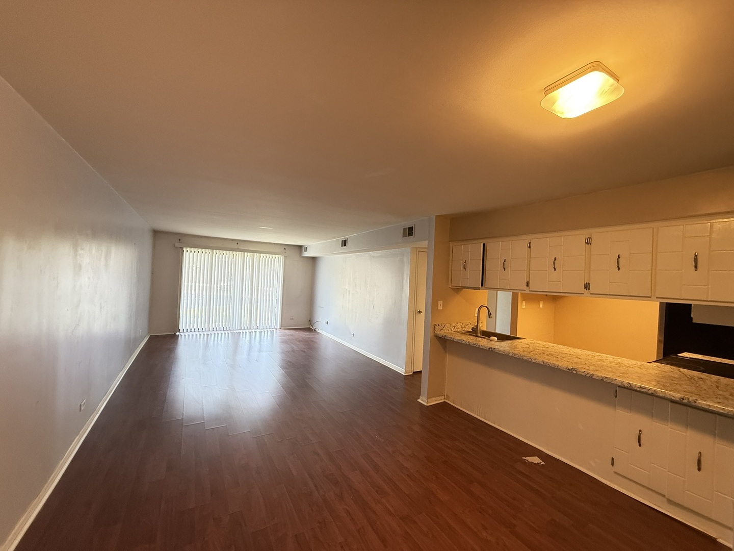 830 Elder Road, Unit 111 Homewood, IL 60430 - Photo 4 of 15 a view of a kitchen with wooden floor and electronic appliances