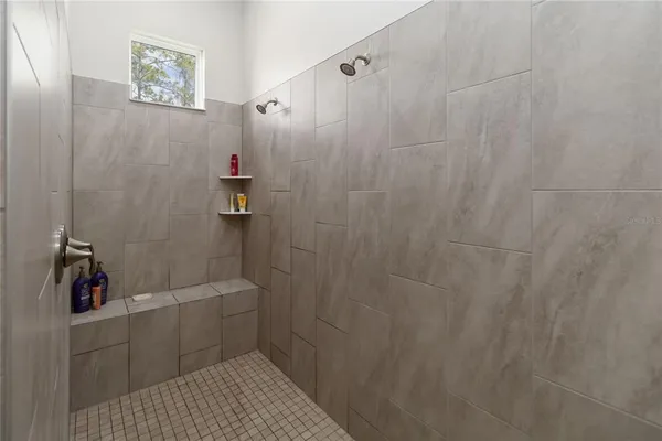 a bedroom with a bed and a desk