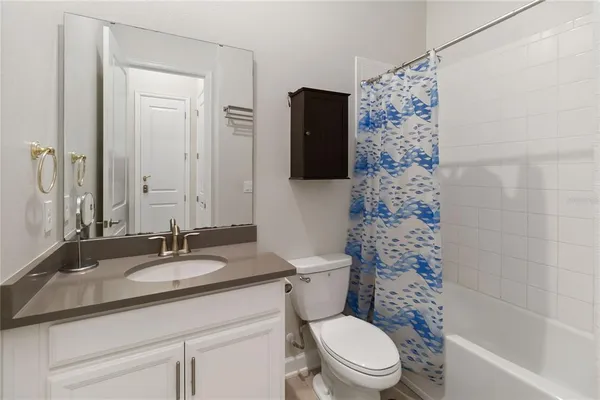 a bedroom with a bed and a table