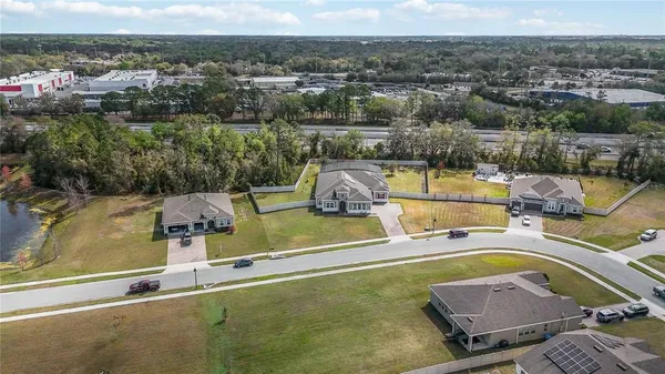 an aerial view of residential houses with outdoor space