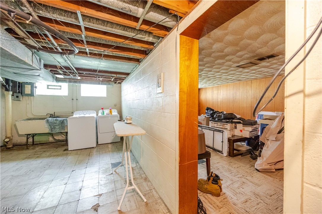 3825 Mayfield Road Cleveland Heights, OH 44121 - Photo 15 of 27 Basement utility area featuring a large utility sink and concrete block walls