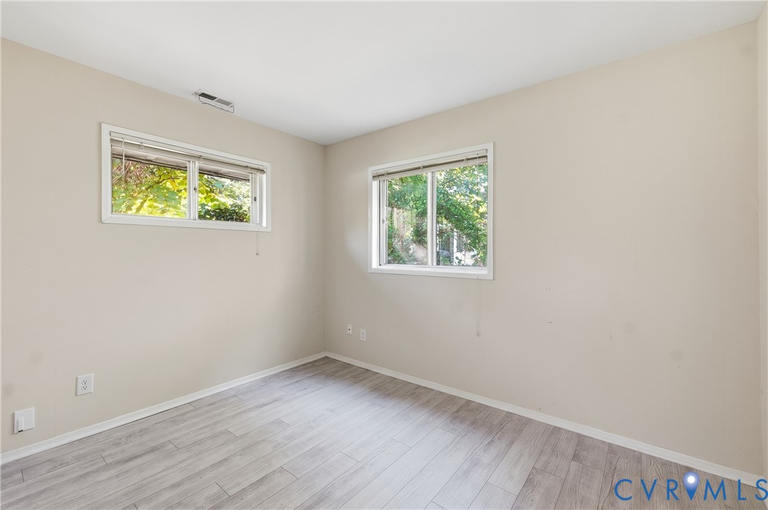 9207 Mapleway Road Richmond, VA 23229 - Photo 33 of 36 Light-toned wood-finish flooring complements the n
