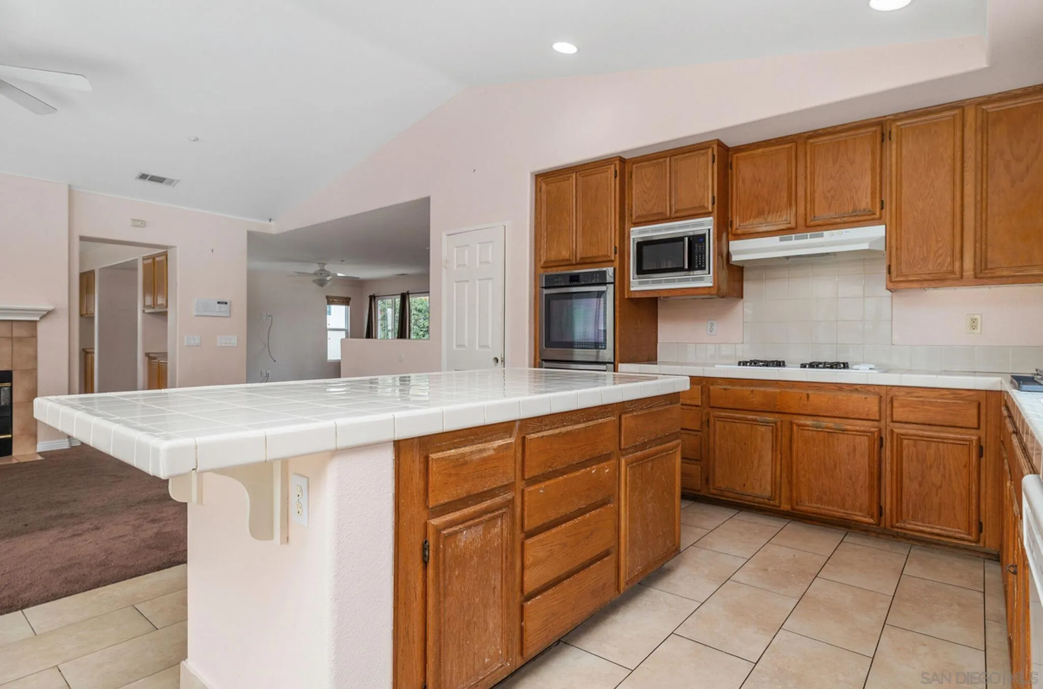 2269 Pointe Parkway Spring Valley, CA 91978 - Photo 12 of 35 a kitchen with stainless steel appliances granite countertop a sink and cabinets