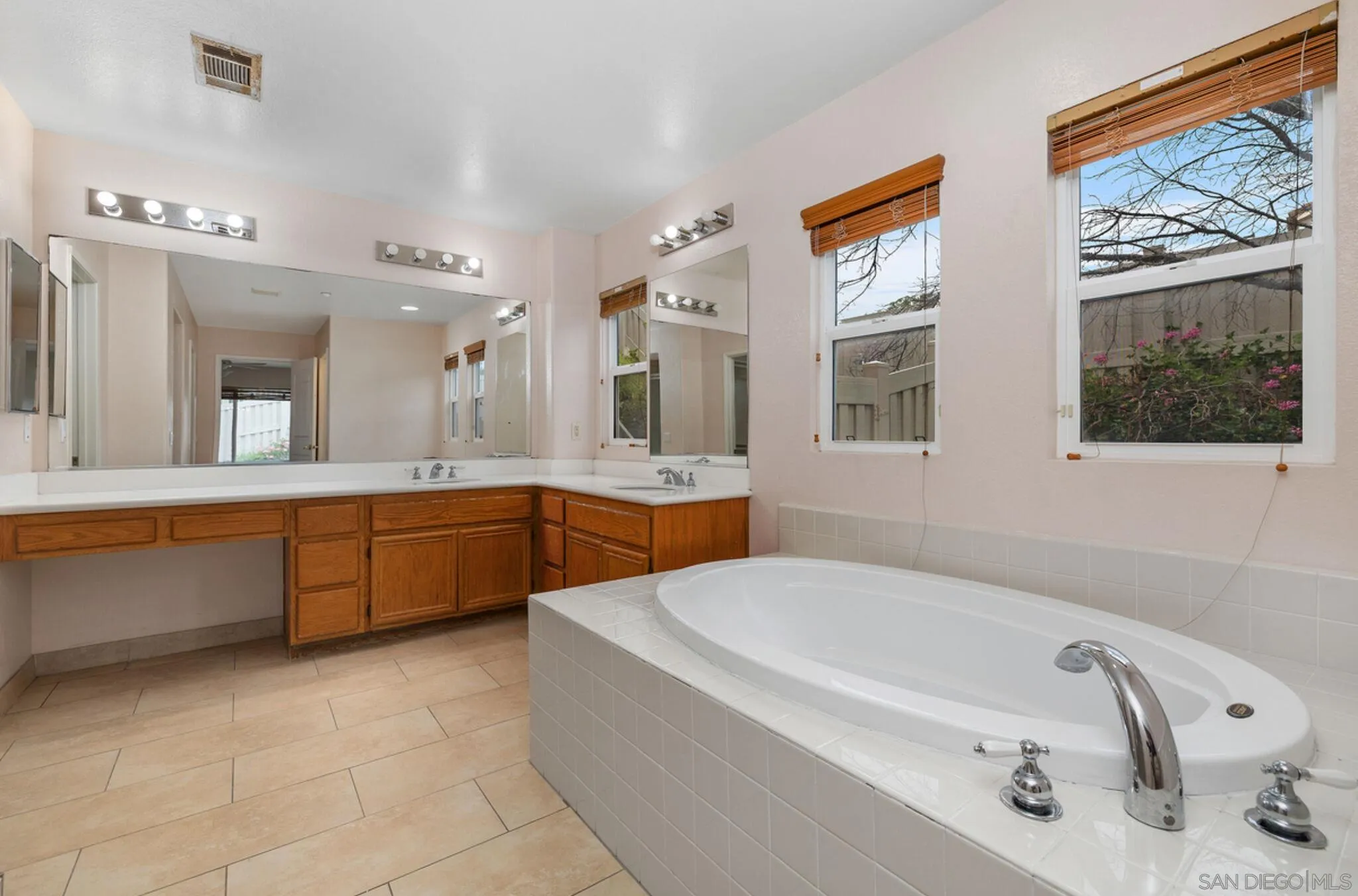 2269 Pointe Parkway Spring Valley, CA 91978 - Photo 25 of 35 a bathroom with a tub sink and mirror