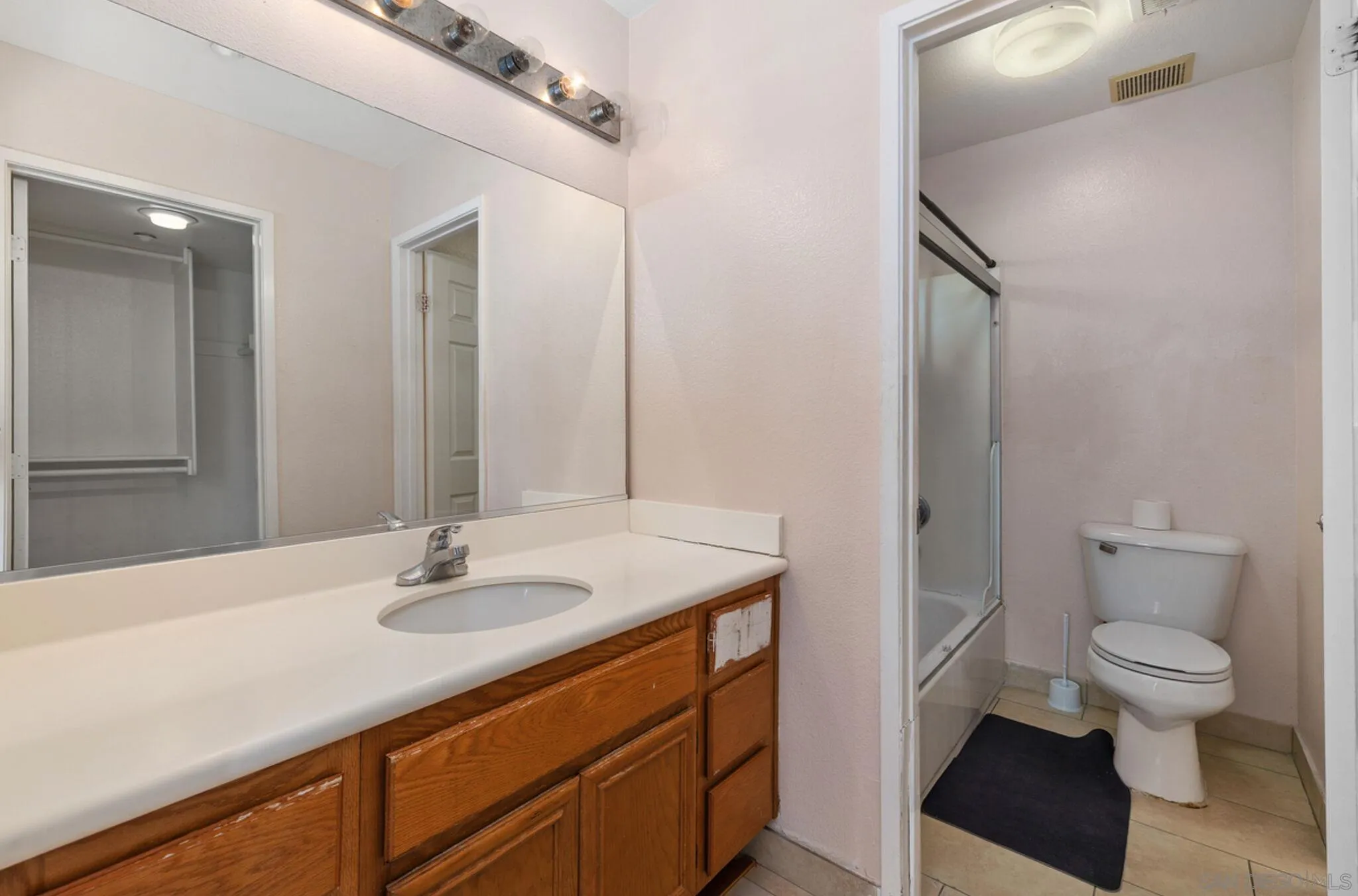 2269 Pointe Parkway Spring Valley, CA 91978 - Photo 29 of 35 a bathroom with a sink a toilet and a mirror