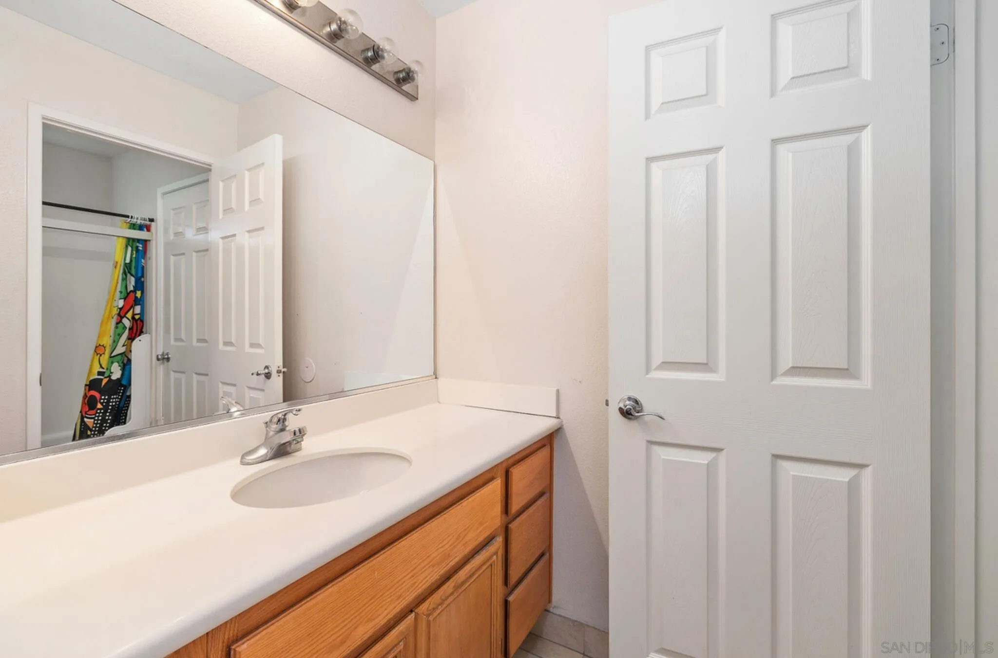 2269 Pointe Parkway Spring Valley, CA 91978 - Photo 32 of 35 a bathroom with a sink vanity and a mirror