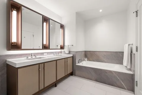 a bathroom with a bathtub and a sink