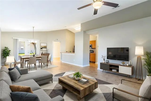 a living room with furniture and a flat screen tv