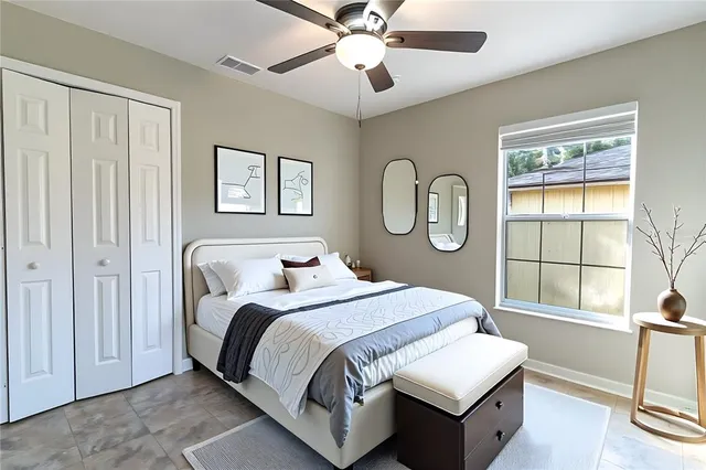 a bedroom with bed and a window