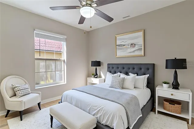 a bedroom with bed and a window