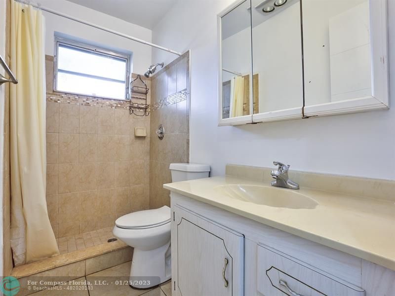 5160 Southwest 40th Avenue, Unit 29D Dania Beach, FL 33314 - Photo 13 of 31 a bathroom with a sink toilet and shower