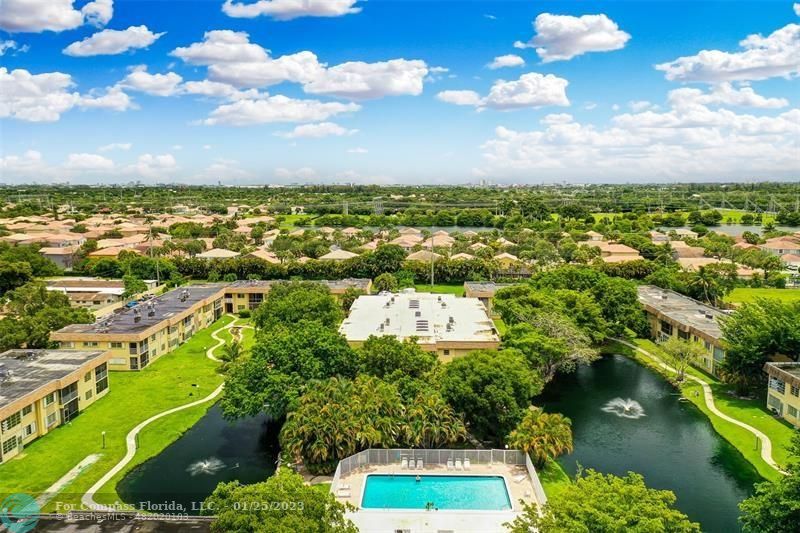 5160 Southwest 40th Avenue, Unit 29D Dania Beach, FL 33314 - Photo 20 of 31 an aerial view of residential houses with outdoor space and trees