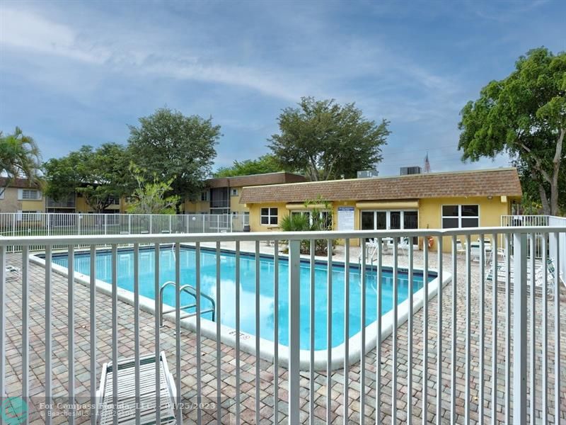 5160 Southwest 40th Avenue, Unit 29D Dania Beach, FL 33314 - Photo 21 of 31 a view of a white building and a roof deck