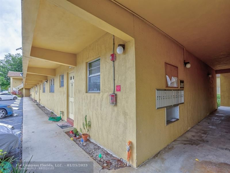 5160 Southwest 40th Avenue, Unit 29D Dania Beach, FL 33314 - Photo 22 of 31 a front view of a house with wooden fence