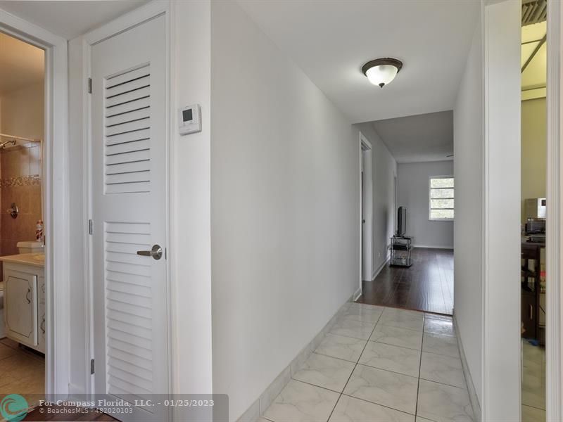 5160 Southwest 40th Avenue, Unit 29D Dania Beach, FL 33314 - Photo 5 of 31 a view of a hallway and closet and a livingroom with furniture