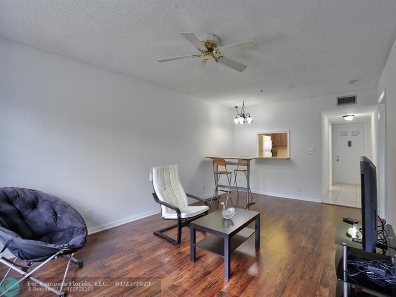 5160 Southwest 40th Avenue, Unit 29D Dania Beach, FL 33314 - Photo 9 of 31 a workspace with furniture and wooden floor