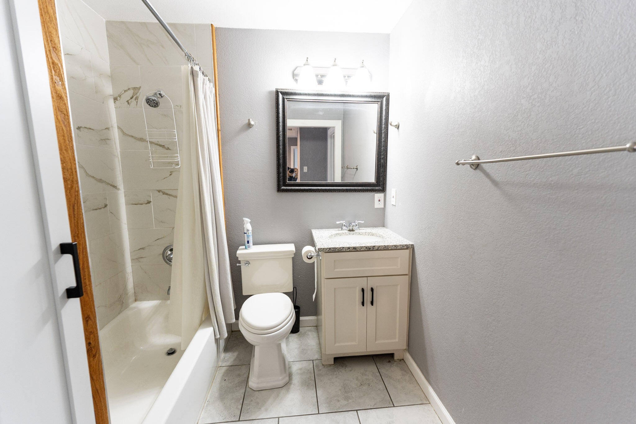 3006 36th Street Lubbock, TX 79413 - Photo 12 of 16 a bathroom with a sink toilet and shower