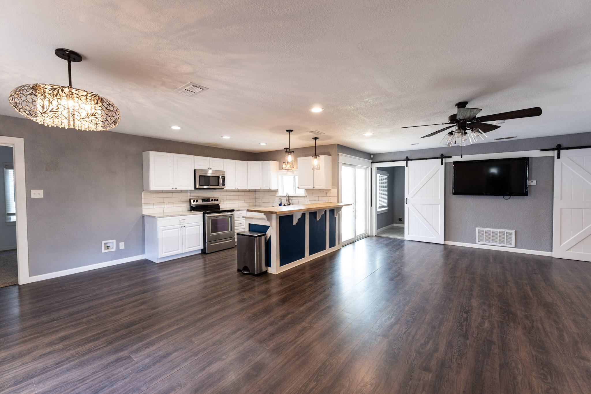 3006 36th Street Lubbock, TX 79413 - Photo 4 of 16 a view of kitchen with sink microwave and refrigerator