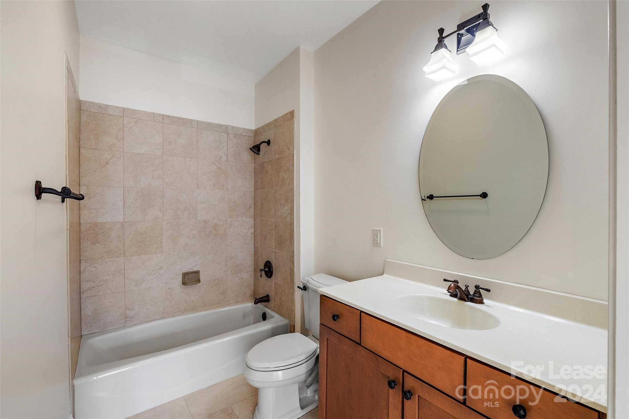 180 Gateway Drive Boone, NC 28607 - Photo 11 of 13 a bathroom with a sink a toilet and a mirror