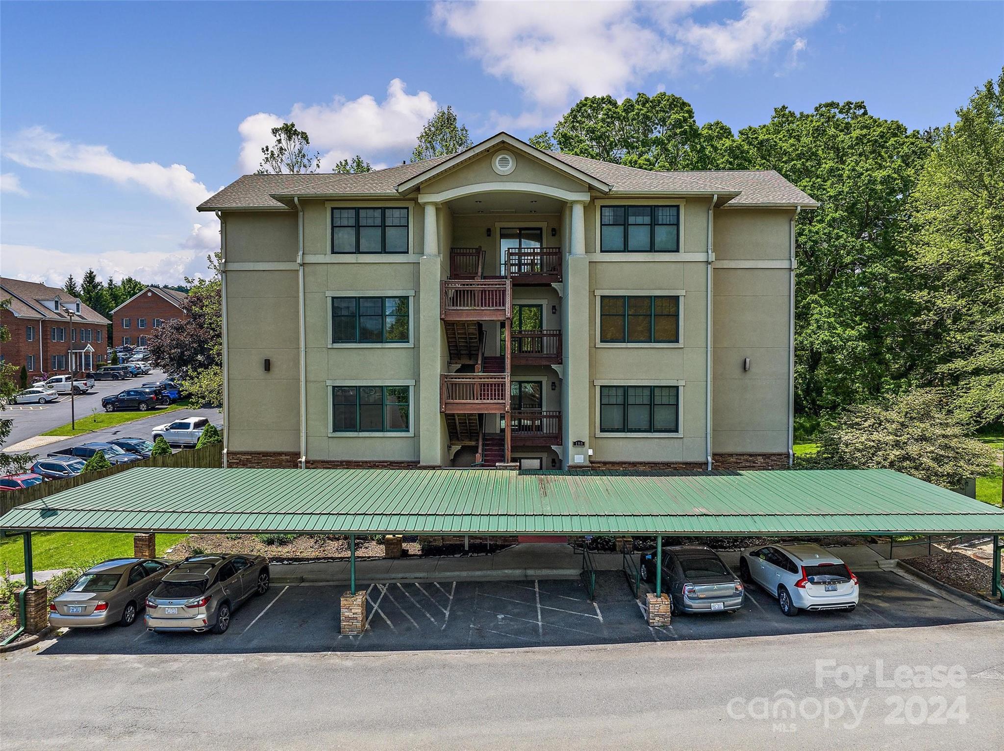 180 Gateway Drive Boone, NC 28607 - Photo 2 of 13 a front view of a house with garden