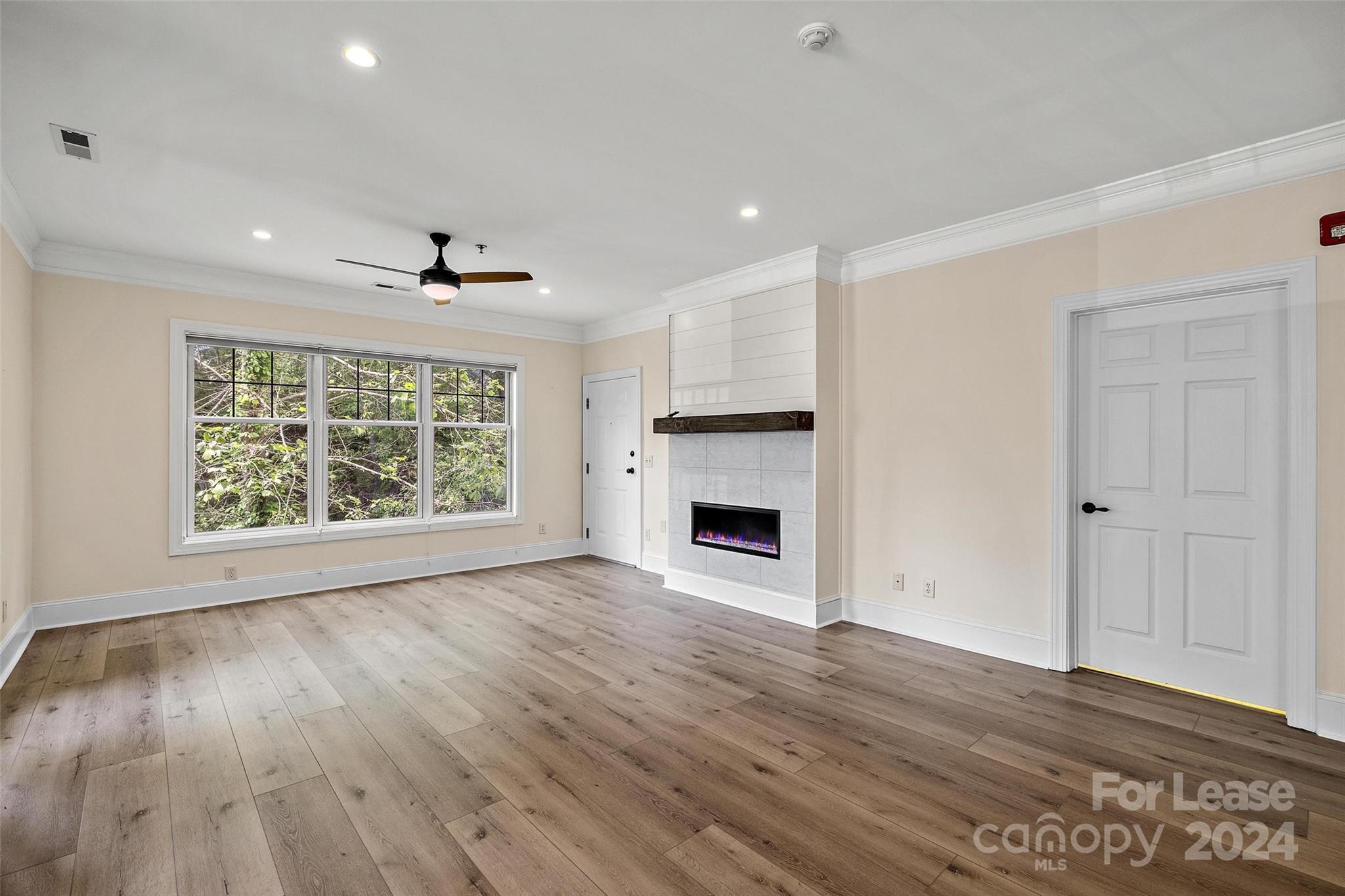 180 Gateway Drive Boone, NC 28607 - Photo 4 of 13 a view of empty room with wooden floor and fireplace