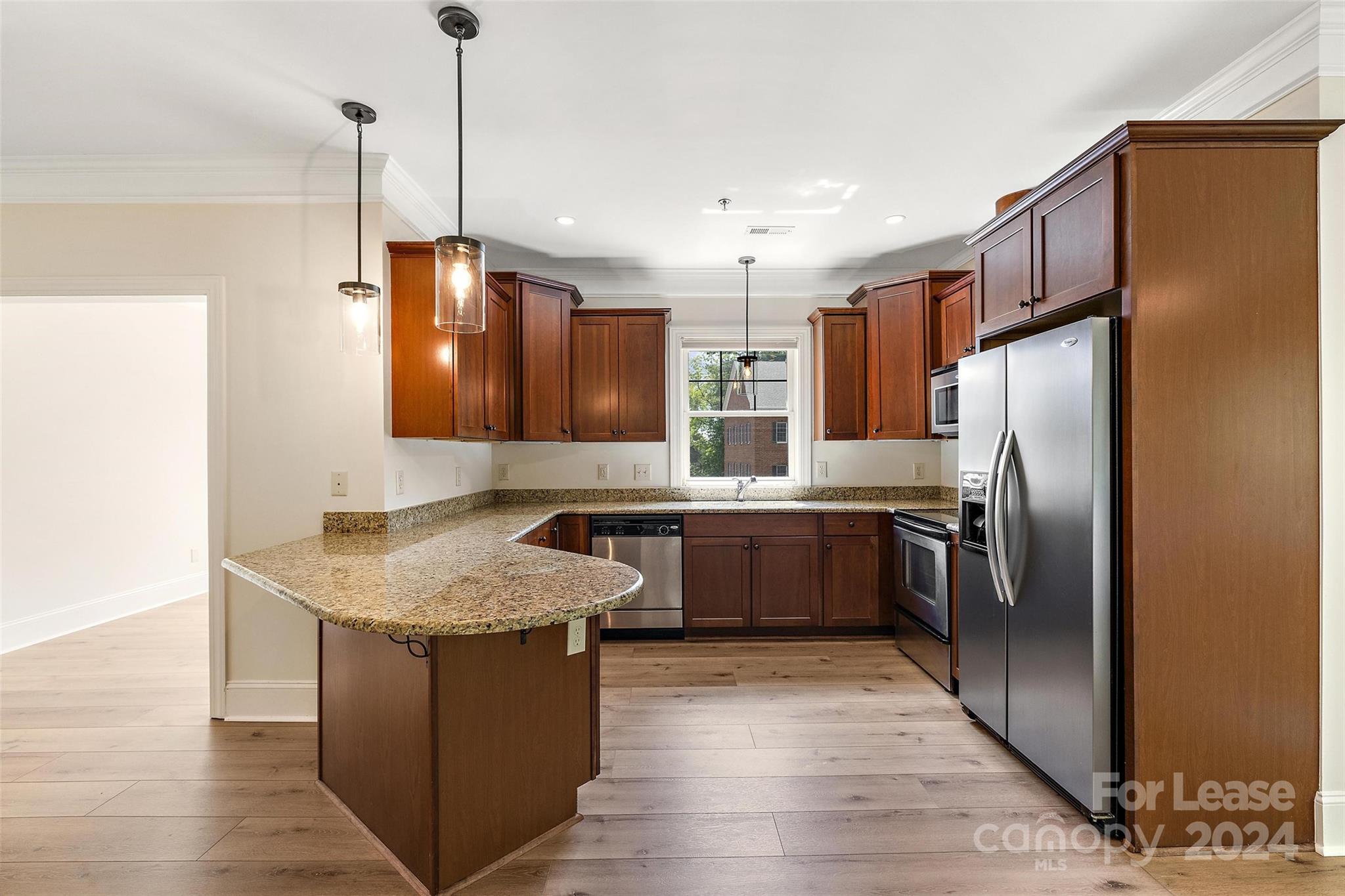 180 Gateway Drive Boone, NC 28607 - Photo 5 of 13 a kitchen with stainless steel appliances granite countertop a sink a refrigerator and a stove
