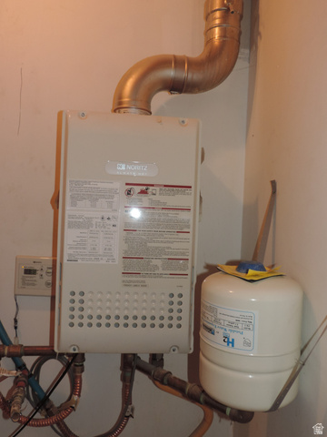 140 North 200 E Street Glenwood, UT 84730 - Photo 34 of 54 Utility room with water heater
