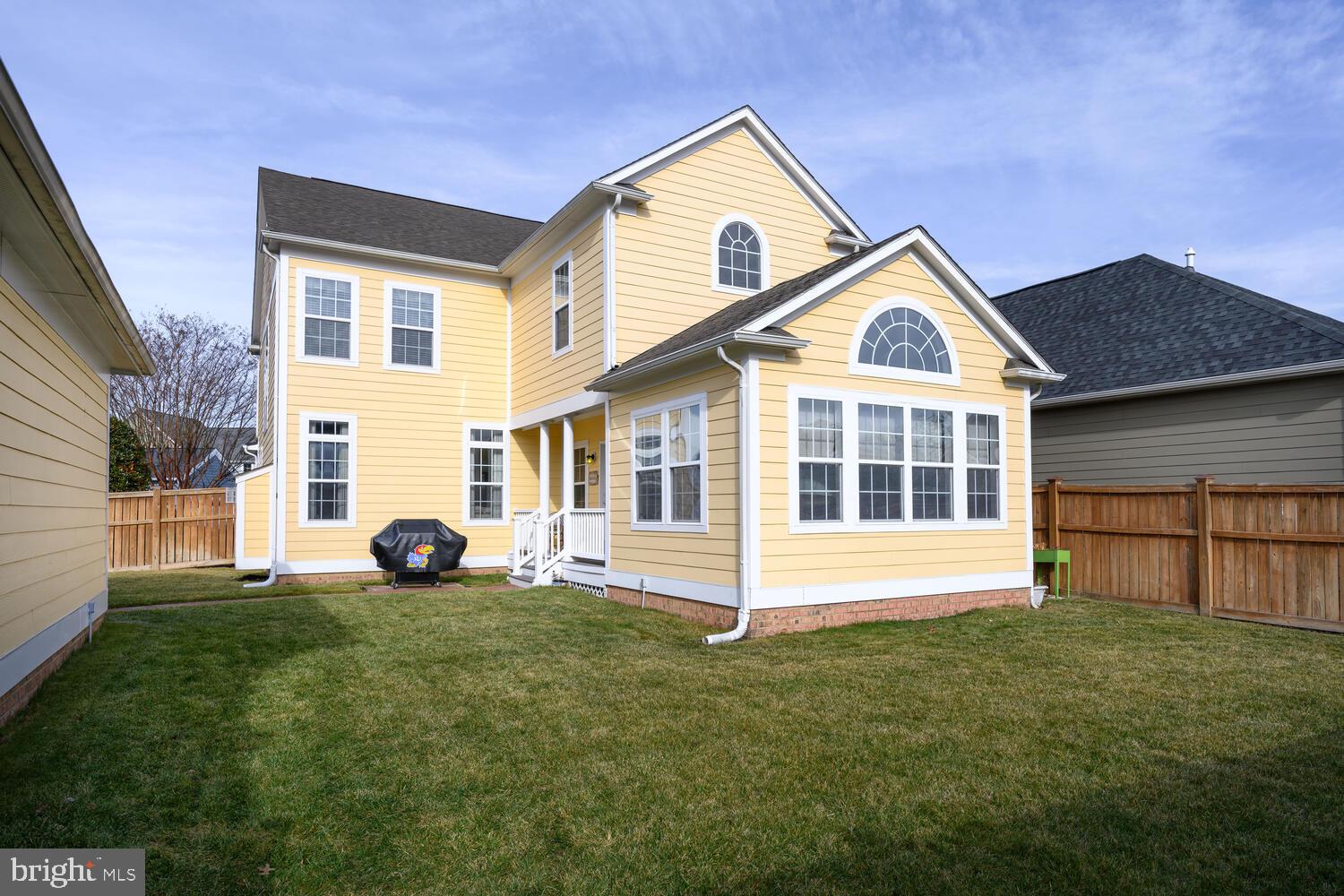 28241 Knapps Easton, MD 21601 - Photo 2 of 69 a view of a white house with a yard and plants
