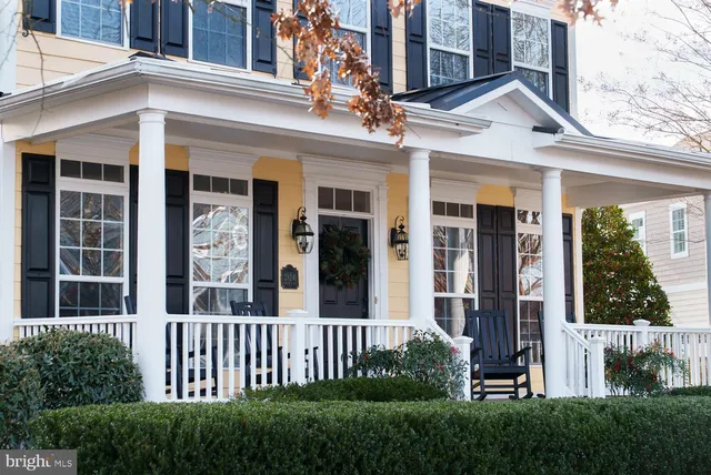 a living room with furniture fireplace and a flat screen tv