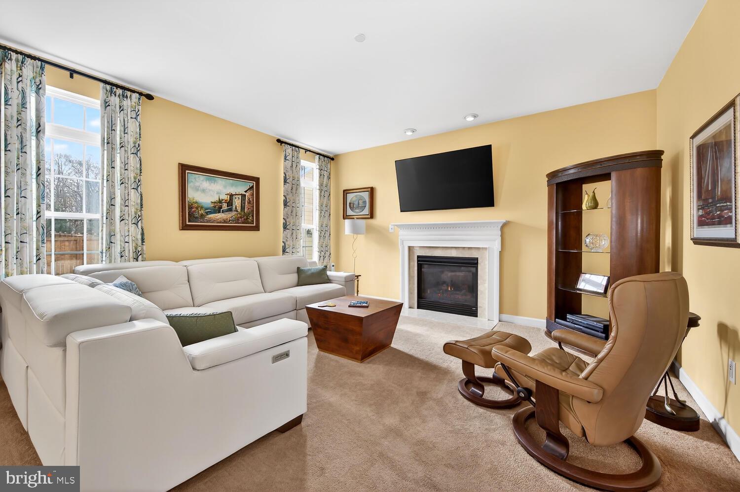 28241 Knapps Easton, MD 21601 - Photo 29 of 69 a living room with furniture fireplace and a flat screen tv