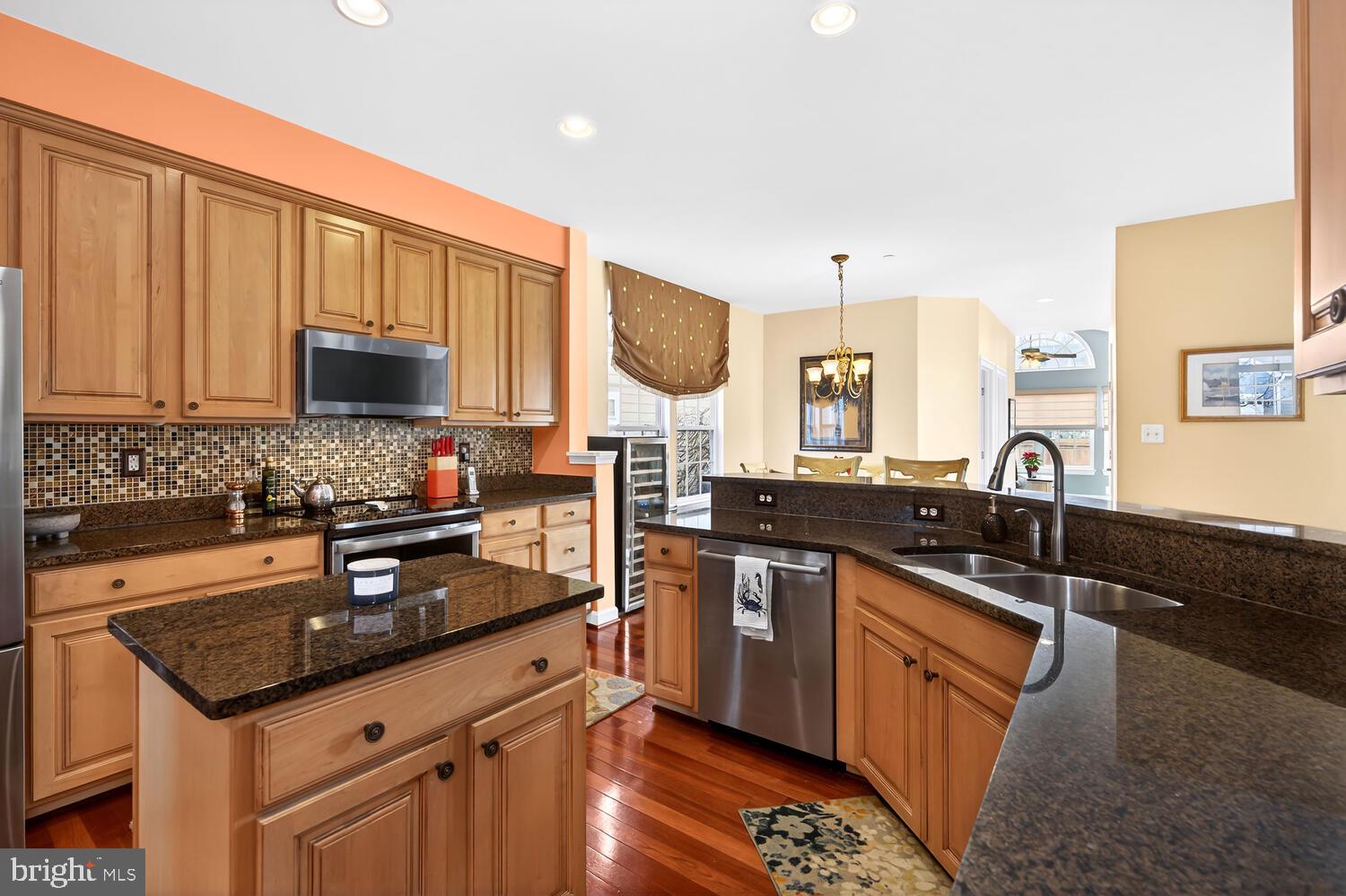 28241 Knapps Easton, MD 21601 - Photo 34 of 69 a kitchen with stainless steel appliances granite countertop a sink stove and cabinets