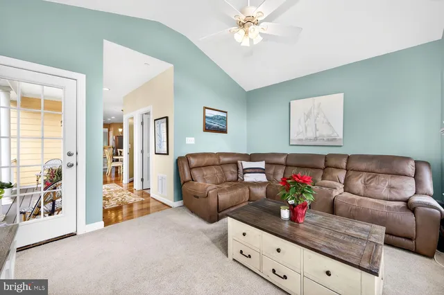 a bedroom with a bed dresser and a window