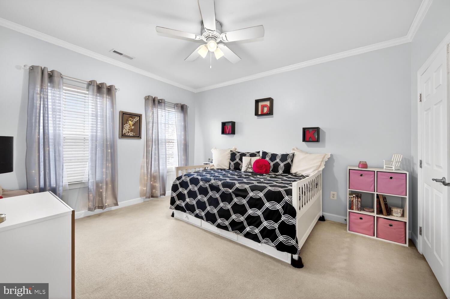 28241 Knapps Easton, MD 21601 - Photo 44 of 69 a bedroom with a bed and a chandelier