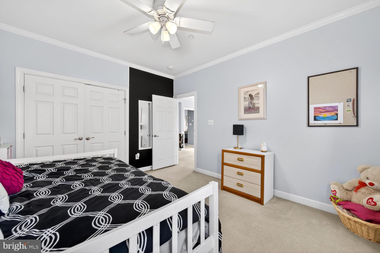 28241 Knapps Easton, MD 21601 - Photo 45 of 69 a bedroom with a bed and a chandelier