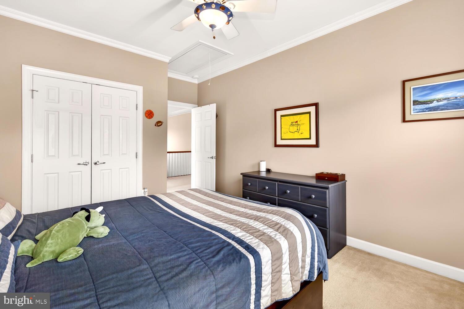 28241 Knapps Easton, MD 21601 - Photo 47 of 69 a bedroom with a bed and a chandelier