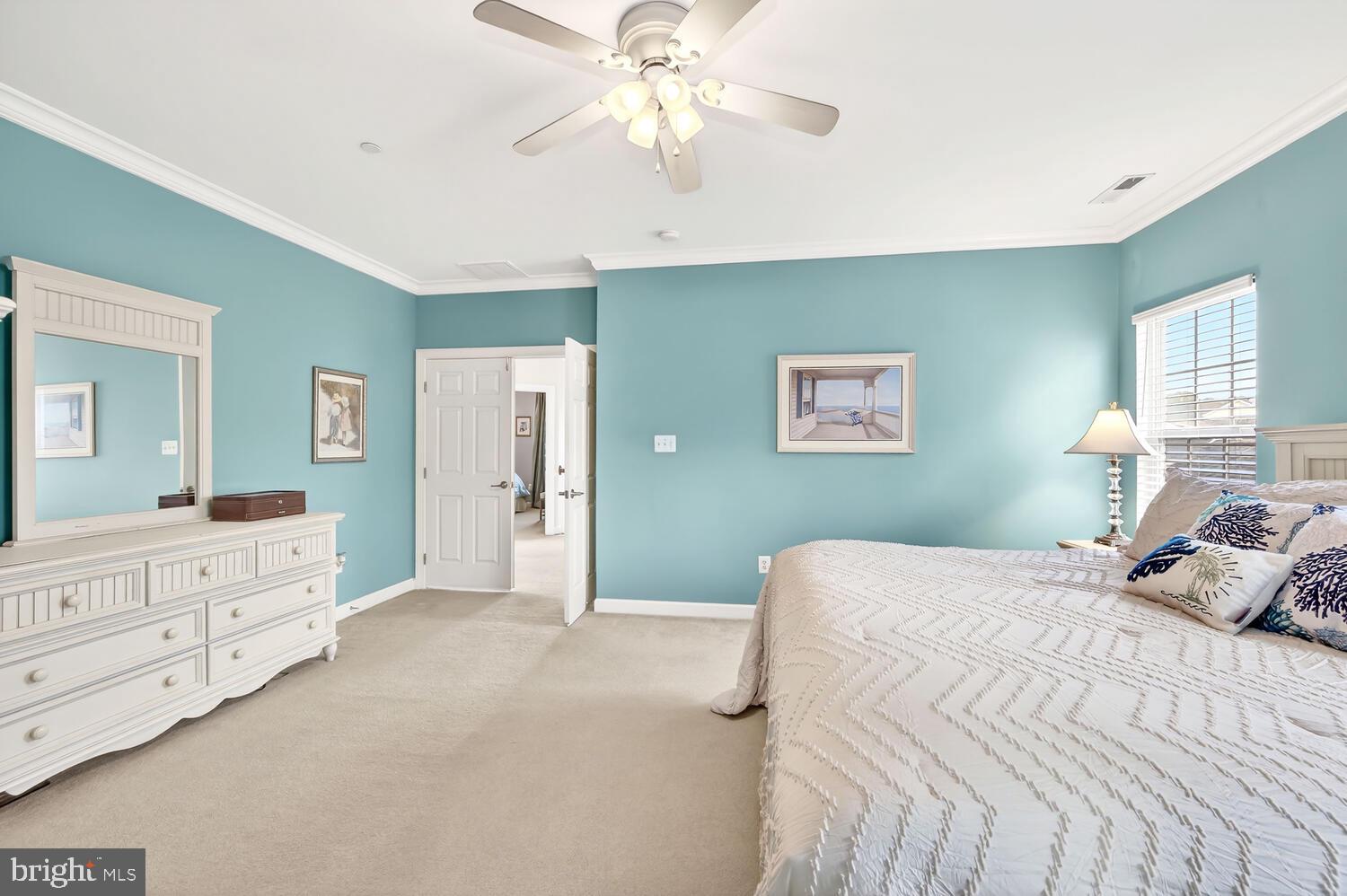 28241 Knapps Easton, MD 21601 - Photo 51 of 69 a bedroom with a large bed and a chandelier