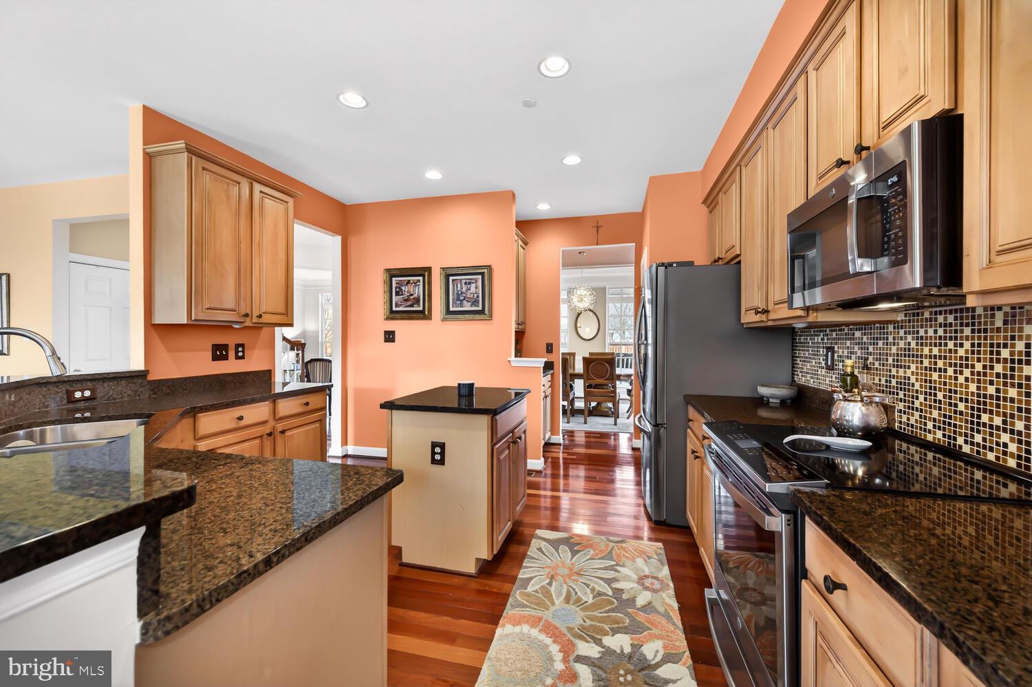 28241 Knapps Easton, MD 21601 - Photo 6 of 69 a kitchen with stainless steel appliances granite countertop a stove a sink and a microwave