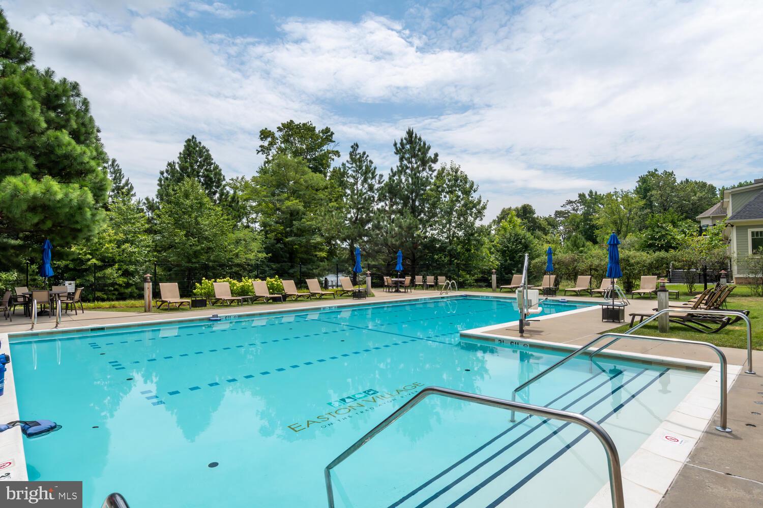 28241 Knapps Easton, MD 21601 - Photo 64 of 69 a view of a swimming pool with an outdoor seating and a garden