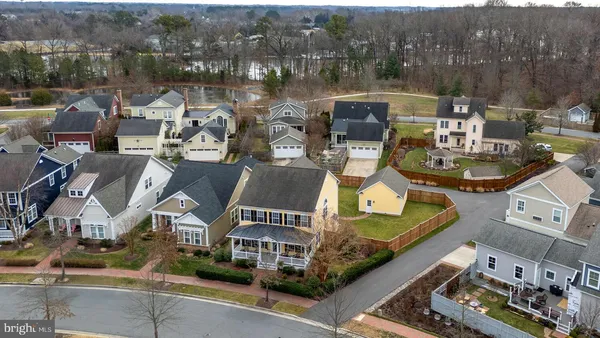 an aerial view of residential house with outdoor space and parking