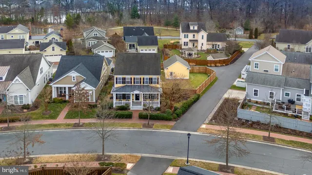 an aerial view of a house with lake view
