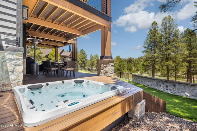 a view of swimming pool with chairs in patio